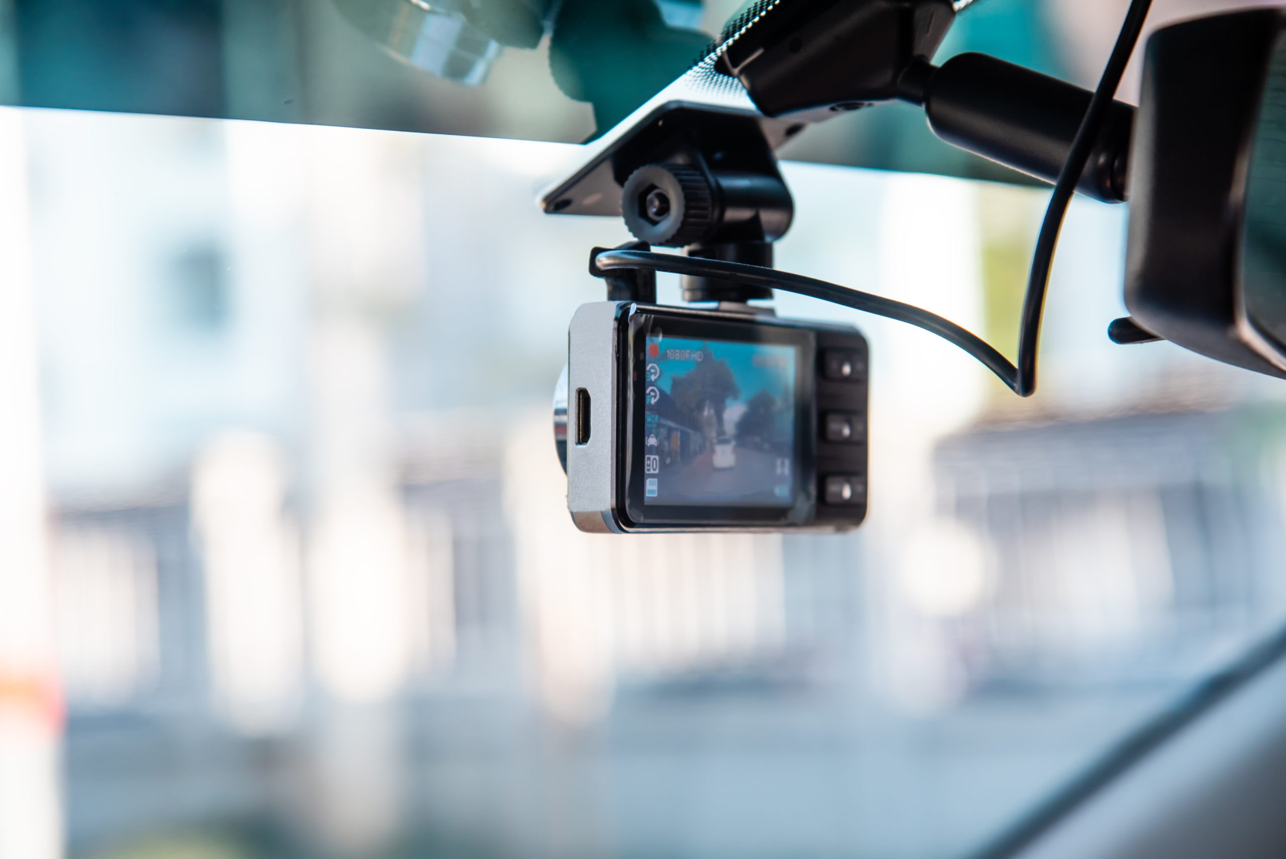 a dashboard camera on a car windshield